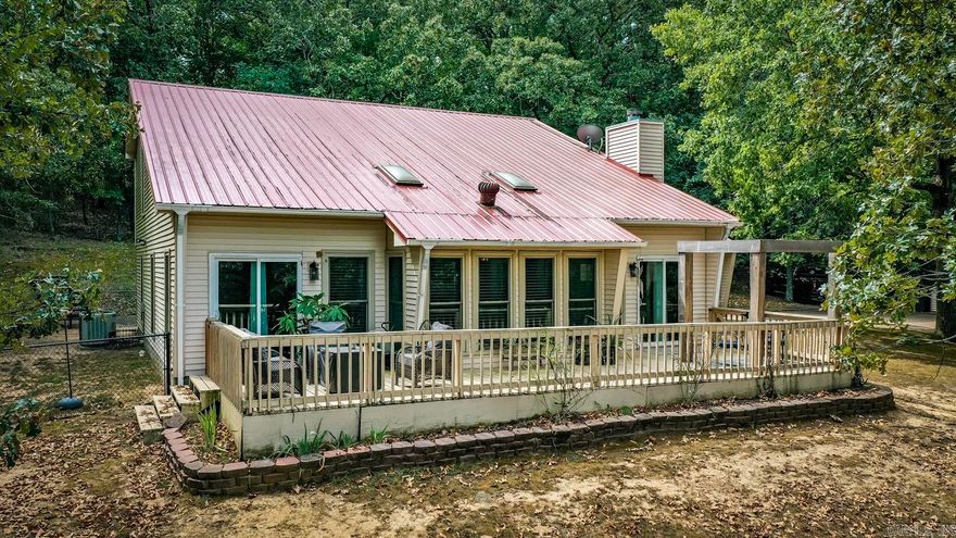 Absolutely Gorgeous Home on 9.08 Acres IN CITY LIMITS! Custom built, Move In ready, 4 bed, 3 bath home tucked back in your own private wooded oasis. There is so much room for all your needs with 16' ceilings, an updated kitchen with granite countertops, an inviting sunroom, a formal living room/formal dining, extra space for office, pond and gardening spots, and front deck that makes you feel like you are in the treetops. This home is a must-see. House is on City Water. Plenty of storage for your toys and hobbies with multiple storage buildings onsite! Extra Water source outside- Well Water for Gardening and yard play.  Don't miss out on seeing this unique home! Seller will entertain offers!