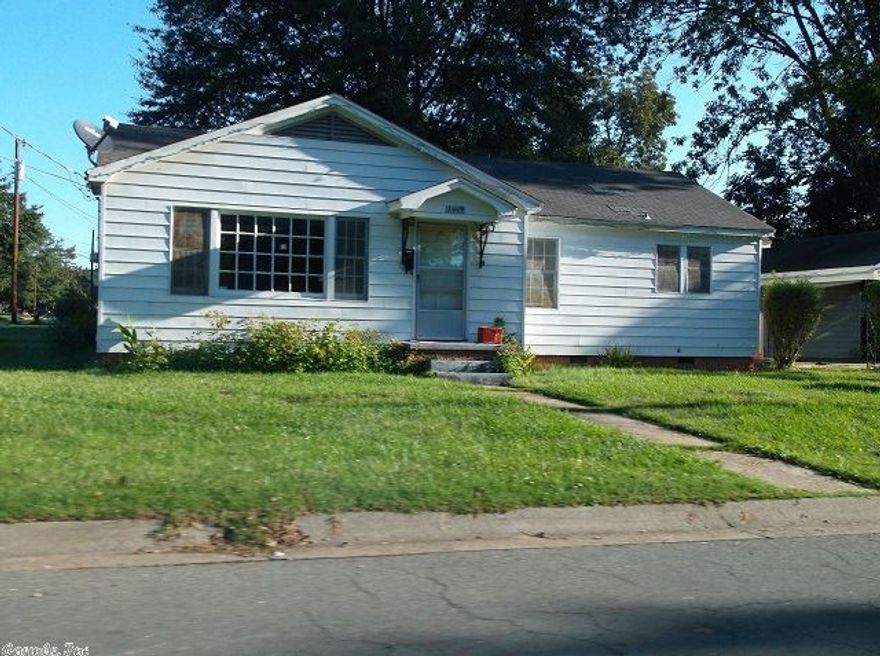 "Sold as is". There are 3 bedroom, 1 bath, great room, kitchen, 2 car carport with a large storage building.