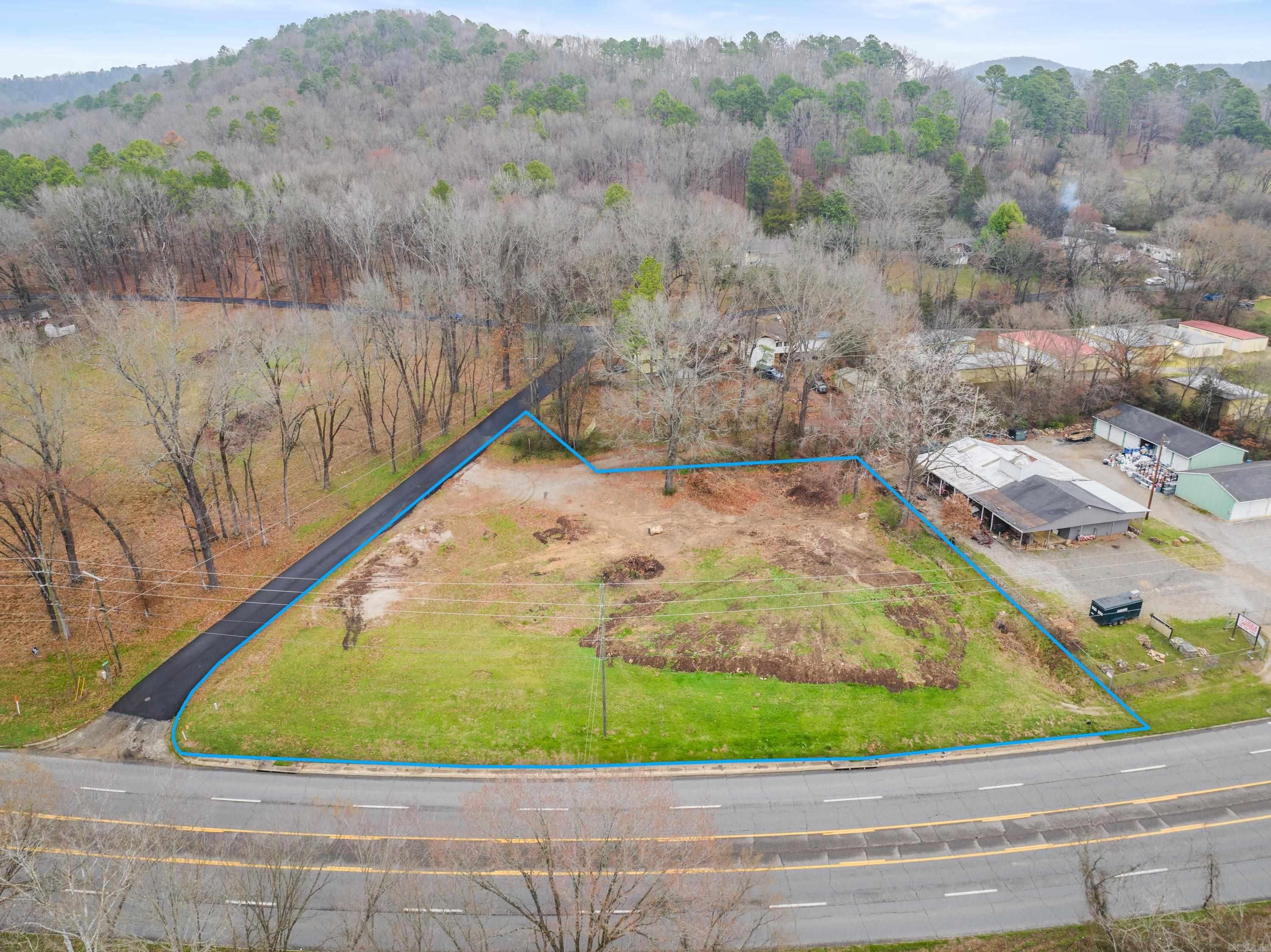 Prime commercial LOT spanning approximately 0.75 acres (exact size to be determined by new survey and parcel split) with excellent frontage on Malvern Road (Hwy 270). This high-visibility location boasts an ARDOT traffic count of 19,000 vehicles per day and is conveniently situated less than a mile from the bypass and just 1.5 miles from Lakeside School. City water and sewer are available on Indian Springs Road, enhancing development potential. Donāt miss this exceptional opportunity in a rapidly growing area!