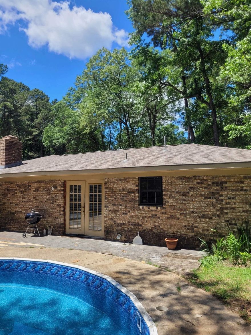 Seller says SELL!!!!! This is priced way below market value! Charming Brick Home in a Wonderful Established Neighborhood! This cozy 3-bedroom, 2-bath home is full of character, featuring built-in shelving, a warm wood-burning fireplace, and charming details throughout. The spacious floor plan offers plenty of room to relax or entertain. Situated on a large lot, the property also includes an in-ground pool—perfect for summer fun and backyard gatherings. With just a splash of your own TLC, this home has the potential to truly shine. A fantastic opportunity in a sought-after neighborhood! Perfect home to help you ring in the New Years!