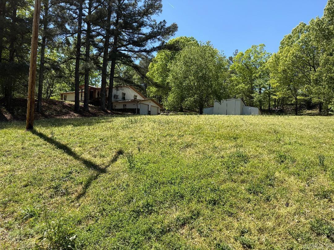 Peaceful Country Living on Crowley’s Ridge! If you’ve been dreaming of a quiet place in the country with room to breathe, this is it! This 3 bed, 2 bath home sits on 3 beautiful acres surrounded by woods, offering the kind of peace and privacy only the country can provide. The home features updated flooring, a 2-car basement garage with extra space that makes a great storm shelter, and a solid metal shop—perfect for working on projects, storing equipment, or starting that hobby you’ve been thinking about. Located just a few miles outside of Wynne and only about 30 minutes to Jonesboro, you’ll have the best of both worlds—country quiet with town close by. Come take a look at this little slice of Crowley’s Ridge—homes like this don’t last long!