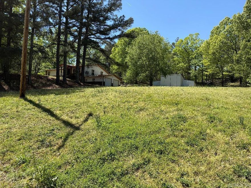 Peaceful Country Living on Crowley’s Ridge! If you’ve been dreaming of a quiet place in the country with room to breathe, this is it! This 3 bed, 2 bath home sits on 3 beautiful acres surrounded by woods, offering the kind of peace and privacy only the country can provide.  The home features updated flooring, a 2-car basement garage with extra space that makes a great storm shelter, and a solid metal shop—perfect for working on projects, storing equipment, or starting that hobby you’ve been thinking about.  Located just a few miles outside of Wynne and only about 30 minutes to Jonesboro, you’ll have the best of both worlds—country quiet with town close by.  Come take a look at this little slice of Crowley’s Ridge—homes like this don’t last long!