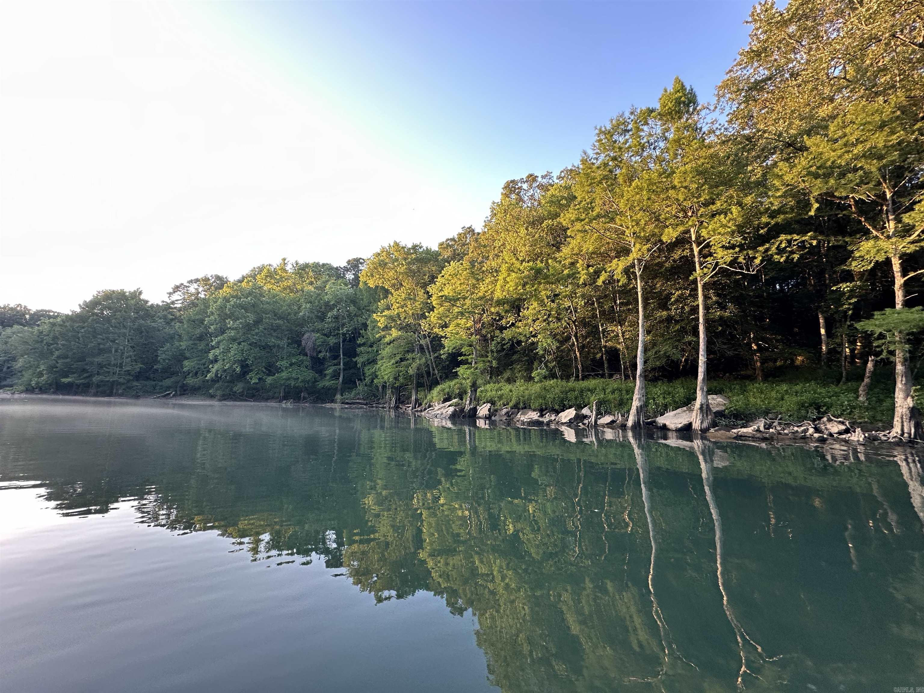 1.69 acres m/l of trout fishing on your riverfront property on the Little Red River just 3 miles from Pangburn. (Lot #14. See map.) World class trout fishing right outside your back door! This stretch of the Little Red River is known for both quality and quantity of trout. There are numerous rainbow trout and brown trout that call this stretch of the river home. You even have access to your own private boat launch! This property boasts access to your own private, gated boat launch. Located 3.2 miles upstream from the Ramsey's Access, and 2.6 miles downstream from the Dripping Springs Access. If you know, the Little Red River is home for many aquatic species, and also many other species unique to a tailwater ecosystem. It's not uncommon to see bald eagles, river otters, whitetail deer, turkey, and a multitude of migrating waterfowl. There are many resident Canada geese and wood ducks! It's truly a sportsman's paradise. This riverfront property is tucked away and protected by large, mature pine trees on the north side, and the Little Red River on the south side. For you lake lovers, you're 15 miles from the Dam Site boat launch on Greers Ferry Lake!