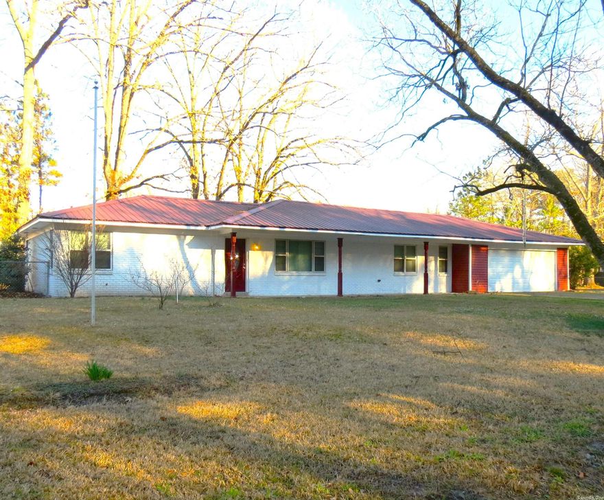 Wow!!  This brick home has been updated and looks amazing!!  Open living/kitchen/den area, new light fixtures, new paint, new ss appliances, new flooring. Metal roof, large double garage, large laundry room.  You do not want to miss seeing this home on the large corner lot.  Two outside storage buildings.  Call me today for your personal tour.