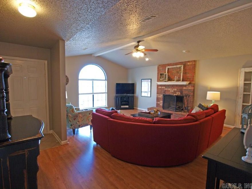 Extremely cute professionally decorated home with inviting greatroom w/fp, laminate flooring, paladium window, vaulted ceiling, formal dining, cook's kitchen w/lot's of storage, large window looking out onto a lrg deck for entertaining & parklike yard, play equipment conveys for children w/fenced yard, New roof 2010, lrg master br and bath, many upgrades, oversize garage for storage! New AC and heat last year!