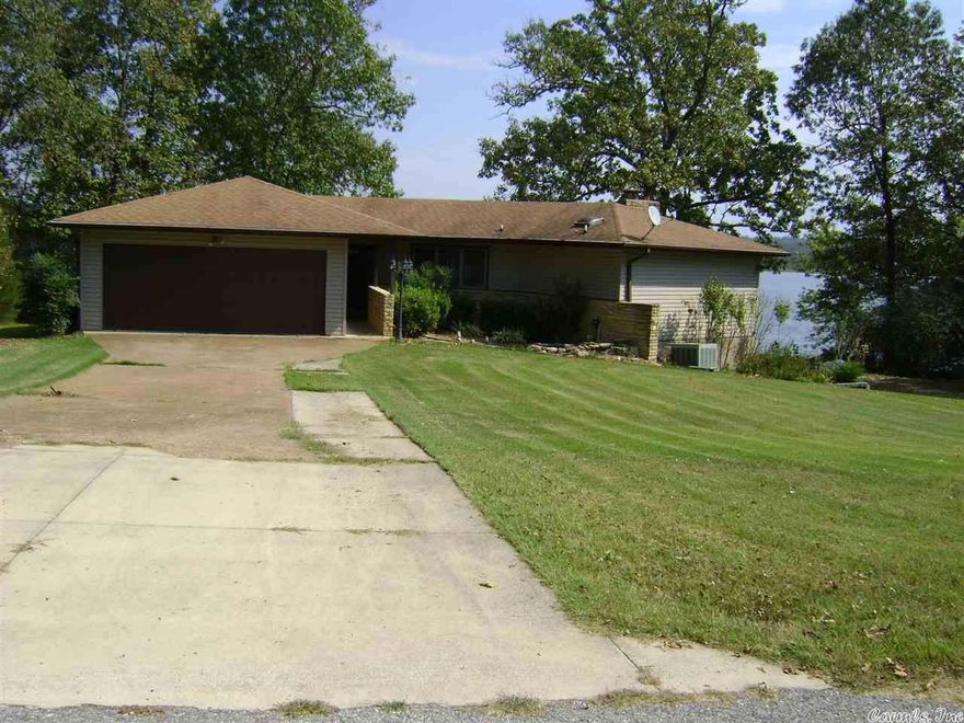 Wonderful Crown Lake Home located on a cul-de-sac street that has been renovated with all new cabinets and stainless steel appliances in the kitchen. Upper level has wood floors and ceramic tile. A great gas log fireplace in the open concept living, dining, kitchen combo. Three patio doors leading to a nice deck with a fantastic lake view. Two bed, 2 bath upstairs and one bath and one bedroom down stairs with a game room and patio with Jen air grill combo. A nice boat dock, landscaped yard, sprinkler sys.