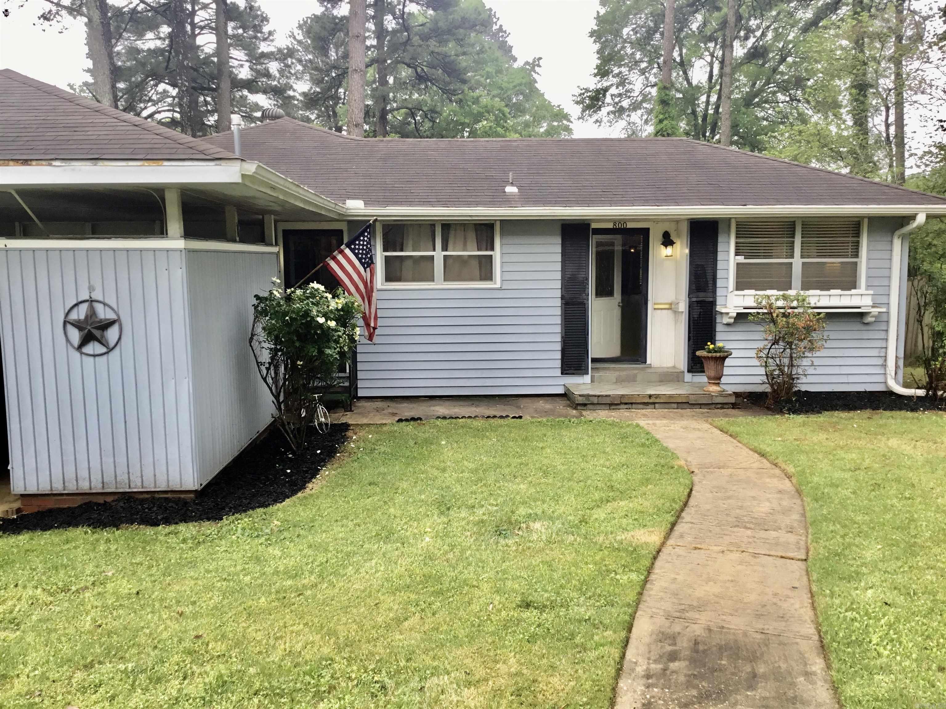 Cute home in established neighborhood. Great for first time buyers, downsizing or investment. Original hardwood floors in this sweet home. Large lot, with great landscaping. Extra's are playground equipment in fenced backyard, misting system, lights, and fans on back patio. Car wash spigots on the front of the carport. Storage unit and all appliances convey as well. Close to restaurants, shopping and major thoroughfares.