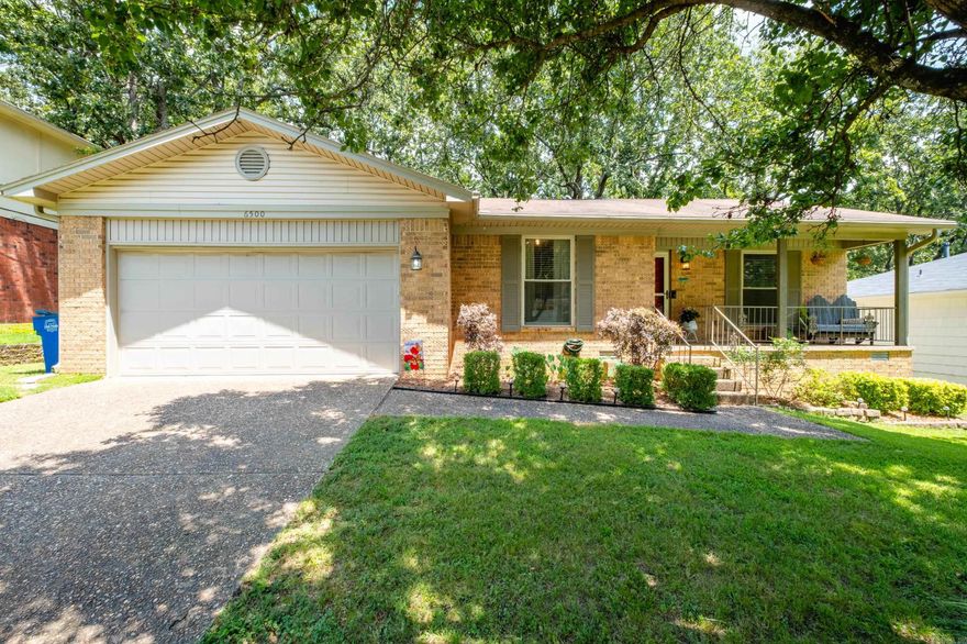 Welcome to a move-in-ready, one-level home full of charm and updates. Situated on a quiet street, this home features a covered front porch, an attached two car garage, and a fully fenced backyard with a freshly painted deck—perfect for relaxing or entertaining. Inside, you’ll find a vaulted living room with a beautiful wood beam. There is hard surface flooring throughout. An updated kitchen with a new tile backsplash, modern light fixtures, cabinet pulls, faucet, and dishwasher(2023). The popcorn ceilings have been scraped throughout (except laundry room & primary closet), giving the home a clean, refreshed feel. The primary bedroom is separate from the guest bedrooms. Additional updates include new storm doors on the front and back (2021), a new ceiling fan in the primary bedroom, and a new HVAC system in 2024. This home is ready for its new owner!