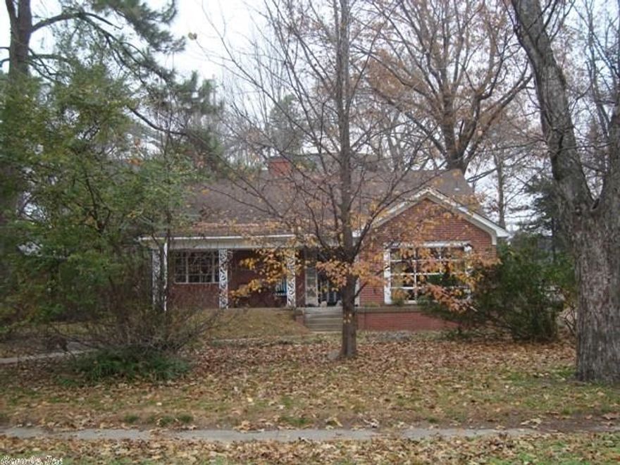 If you've seen this property before, you MUST see it again to appreciate the incredible changes the current owner has made! This 3 BR, 2 BA brick home has 2450 sqft living space on main floor, approx. 400 sqft attic space that can be finished & a 225 sqft basement. New vinyl flooring in dining room & hallway & new paint inside. Living room & bedrooms have hard wood (some areas patched over the years). Extra lot behind house is now cleared. Tree house has new deck & screens on building have been repaired.