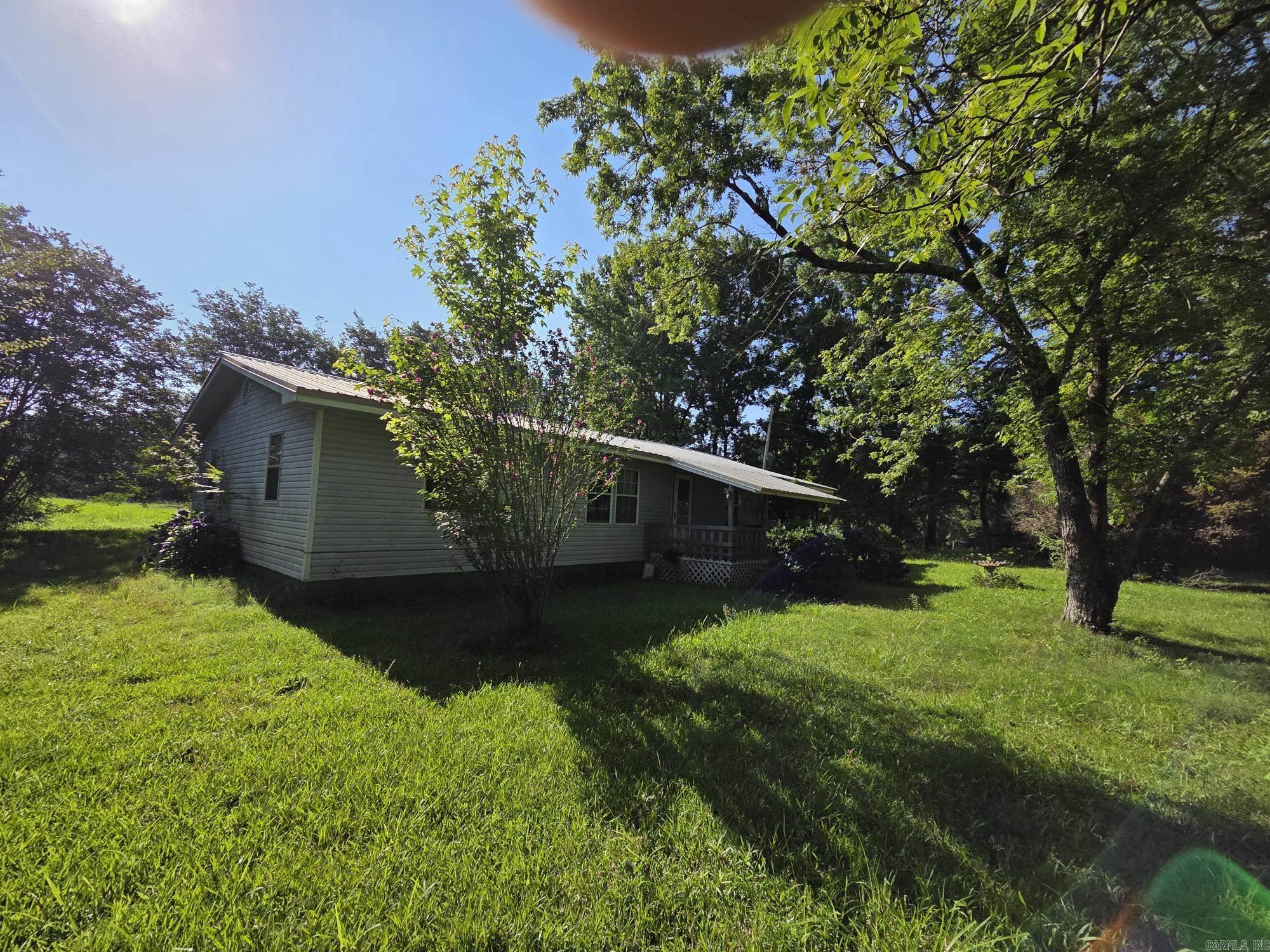 3 bedrooms, 2 bath fixer upper on 2 acres close to Central School. This house has a great yard & trees, a storm shelter or canning room under the carport & is all electric. It will need some new floor joist, subflooring & all new flooring. Paint & updates are also needed. With a little TLC this could be a great country place. It has a working central heat & air, a metal roof & large living room with a dining/kitchen combo. Investors or builders preferred. CASH OR IN-HOUSE BANK LOANS ONLY! No rent, rent to own, owner finance, VA, FHA or RD. To be sold "AS IS". See agents remarks.