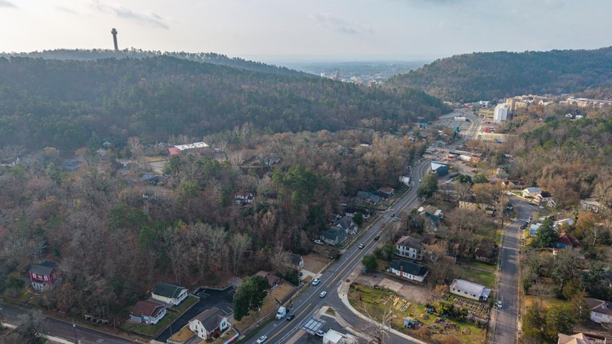 Adorable 2022-built cottage offering the perfect blend of charm, quality construction, and investment potential! Located just 0.7miles from the Arlington Hotel, this thoughtfully designed property sits in an Opportunity Zone and allows for short-term rentals,with flexibility for residential or commercial zoning. Inside, the bright and open floor plan lives large with a spacious feel, highlightedby shiplap walls, a statement chandelier, and a beautifully finished full kitchen featuring quality materials and craftsmanshipthroughout. Every detail reflects a well-built home with character and style. Step outside to enjoy the cabin-inspired exterior,original rock retaining walls, and scenic mountain views that create a true Hot Springs retreat atmosphere. Ideally positioned withinwalking distance to Uptown and Downtown dining, shopping, coffee bars, and nearby mountain trails & biking trails, this propertyoffers both convenience and lifestyle appeal for guests or full-time use. A rare opportunity for a turnkey short-term rental, weekendgetaway, or unique commercial venture in one of Hot Springs’ most desirable and walkable locations! *acreage unknown...to bedecided by new survey seller.