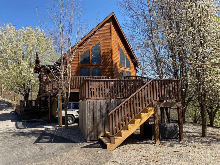 Discover your dream home! This stunning log sided two-story house offers 1500 sq. ft. of luxury living. With 2 bedrooms, 2 baths, stainless steel appliances, gas log fireplace, a wraparound deck, and a basement workshop area, this home has it all. The outbuilding can be transformed into your dream crafting area. Complete with a two-car garage and surrounded by breathtaking country views, this property is located near Norfork Lake, Norfork River, and the popular Whispering Woods restaurant. Don't miss out on this slice of paradise!