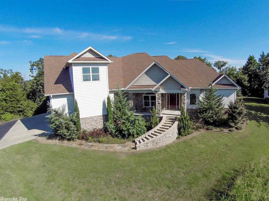 This immaculate home perched on top of the hill has boasts beautiful, mountainous views. When you enter this home, you'll be greeted by a large family room, overlooking the pool and patio area, and built-ins. This home also features a formal dining room, an office, a large master suite, featuring a safe room, a jenn-air jacuzzi tub, and a steam shower. The chefs kitchen includes two dishwashers, a refrigerator that conveys, and cork flooring. Upstairs features 3 bedrooms and 2 full baths. This is a must see