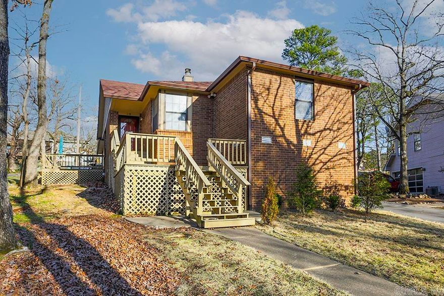 Wonderful one level home just minutes from shopping and schools.  Open floor plan features vaulted ceilings and two living areas, both with fireplaces!  Nicely updated kitchen and bathrooms with a good sized laundry room with storage.  Hardwoods throughout.  Wonderful deck off the side door, just perfect for summer fun. Welcoming front porch as well as inviting flat back door entry from private drive in back of home with two car garage. New roof in 2023. HVAC from 2019. Fresh paint.  Located in desirable Woodland Hills neighborhood.