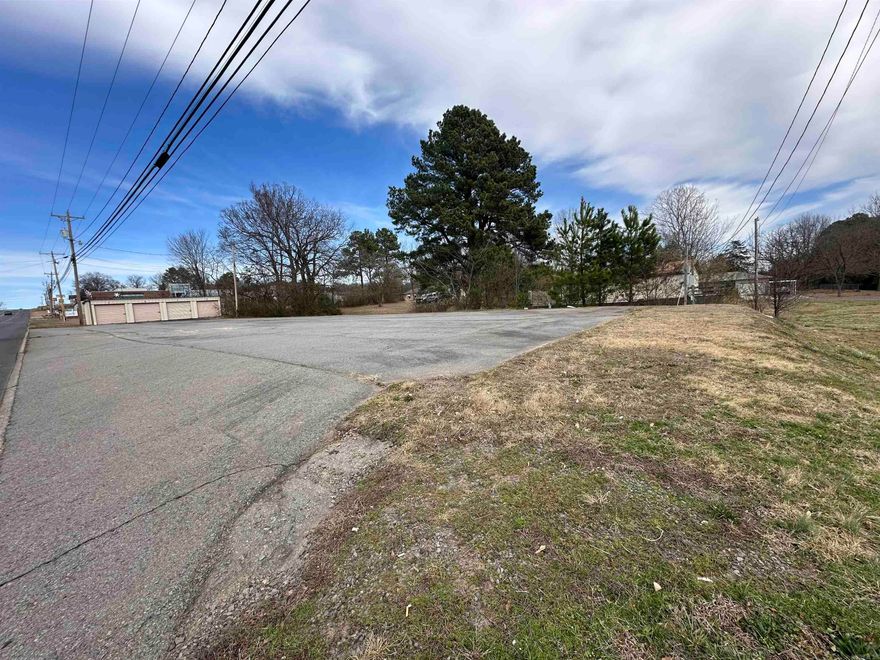 Looking for a place to build your business?  1 Acre lot on Hwy 65 with access on two side. All utilities are available.  There is a existing parking lot and  4 unit mini storage building on the Broadview side and a mobile home located on the back side with access from Ritchscott Street.
