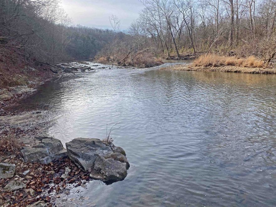 This lot is located on the bluff of the South Fork and is a beautifully wooded and secluded area with access to the river.  Water and electric in area.  Perfect spot to build your dream home.  Priced to sell!  Must take a look.