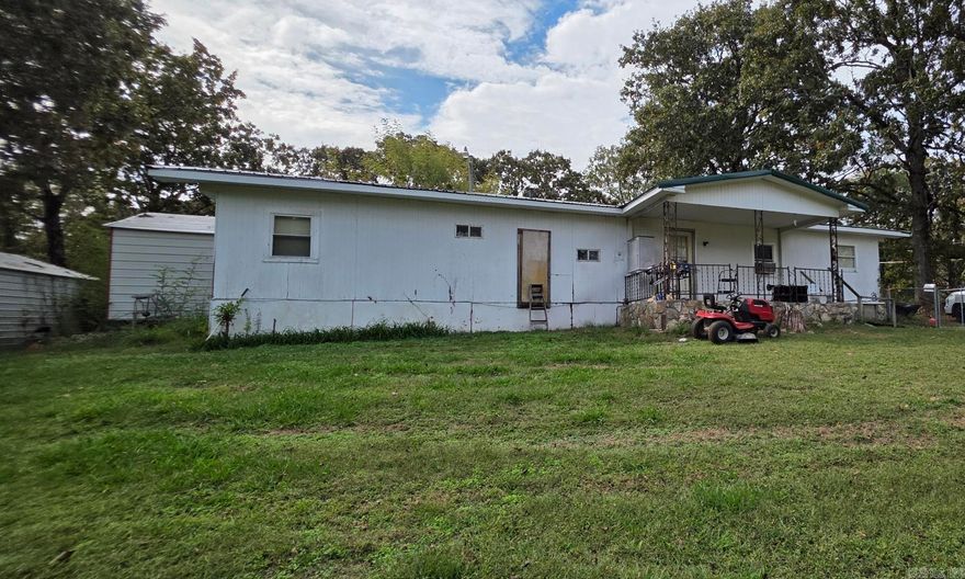 2 Bed, 1 Bath Home on Corner Lot – Just Over a Mile from Mammoth Spring State Park  This 2-bedroom, 1-bath mobile home sits on 0.76 acres and offers great potential for a first home, rental, or investment property. The home needs some TLC, but the location and amenities make it a solid opportunity.  The property is fully fenced with chain link fencing and located on a corner lot. It includes two metal sheds—one of which is insulated and has electricity has 480 sqf, providing a perfect space for a workshop, storage, or could easily be converted into a tiny home or guest space. The second shed has 320 sqf   Conveniently located just over a mile from Mammoth Spring State Park and the Spring River, you’ll have easy access to fishing, floating, and all the outdoor recreation the area is known for.  Property Highlights:  2 Bedrooms, 1 Bathroom  0.76-Acre Corner Lot  Chain Link Fencing Around Entire Property  Two Metal Sheds 480 sqf & 320 sqf (One Insulated with Electric 480sqf )  Just Over a Mile from Mammoth Spring State Park & Spring River  Great Investment or Fixer-Upper Opportunity