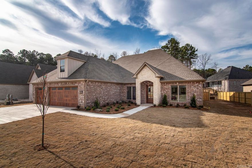 Stunning New Custom Home in Chenal Valley's Abington Court.  Located just off La Marche Drive, this community boasts large, level lots that provide ample space and privacy.  This custom-built masterpiece by Hartness Construction, with over 50 years of experience, presents an open and inviting floor plan ideal for modern living and entertaining. The home features a spacious great room, an open dining area, and a cozy family room complete with a beautiful fireplace. The kitchen is truly a chef’s dream, equipped with high-end stainless-steel appliances, an expansive pantry, and full-size refrigerator and freezer.  A well-appointed office with custom built-ins provides a sophisticated space for working from home. All three main-level bedrooms are en-suites, with the primary suite featuring a tray ceiling, a luxurious custom bathroom, and an extensive built-in closet. Upstairs, an additional bedroom and bathroom make for a perfect guest or bonus space.  The large covered back porch, complete with a fireplace, is the perfect spot for outdoor relaxation, overlooking a level backyard and a lush greenbelt.  Three Car Garage.