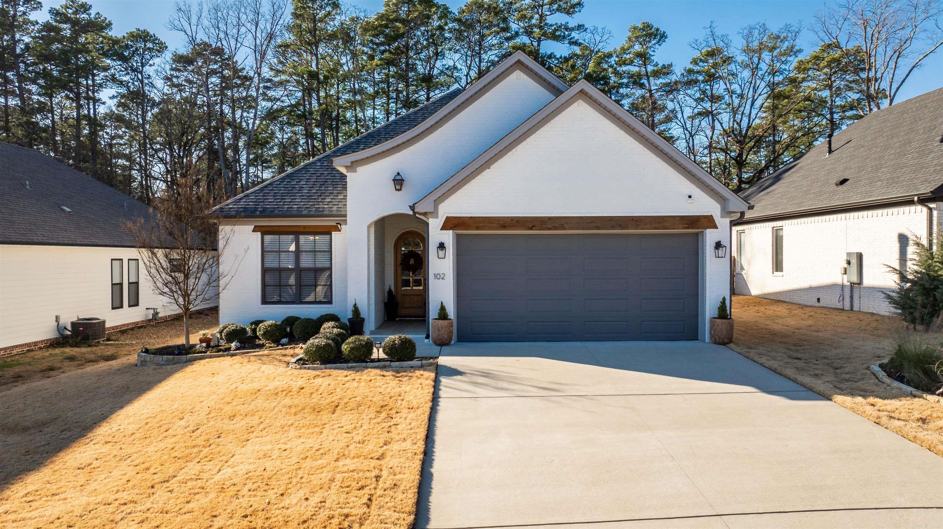 Step into this stunning 2021-built home, where modern design meets comfort and functionality. Nestled in one of the most sought-after neighborhoods, this home boasts meticulous extra landscaping that enhances its curb appeal. Inside, you'll find an open-concept floor plan ideal for entertaining and everyday living. The heart of the home is a chef’s dream kitchen, featuring a spacious island perfect for gatherings. Beautiful built-ins in the living area add both style and practical storage, complementing the home's thoughtful design. The luxurious primary suite offers a massive walk-in closet and a spa-like bathroom with a large walk-in shower. Step outside to the covered back patio and private backyard, a perfect setting for outdoor relaxation or entertaining. This home is the complete package, combining modern features and thoughtful details in a location you’ll love.