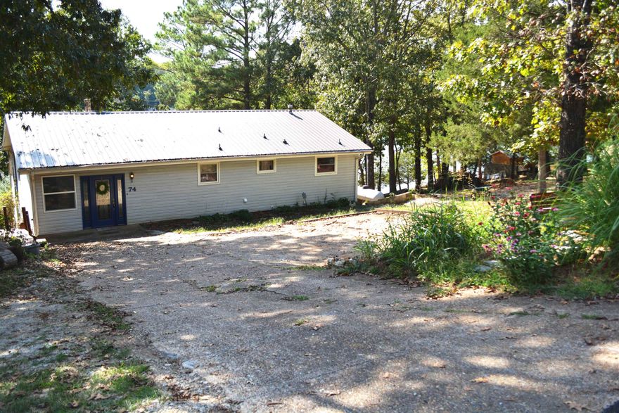 Enjoy Lakefront Living in this Lake Navajo home on 2 lots. Expansive view with almost 170 feet of lake frontage. Recent updates on the lower level walk out basement include pine trim & ceilings, luxury vinyl plank flooring. This walkout basement also incl kitchenette, 3/4 bath w/ walk-in shower, family room and bonus room great for office or crafts. walk out from the family room or bedroom to the covered patio. Upstairs you'll find 3 more bedrooms & full bath w/jetted tub. Walkout to the screened porch from the living room or the lake facing bedroom. Open living/dining/kitchen area w/breakfast bar. List price incl all appliances-fridge, stove, dishwasher, microwave. Freshly painted interior so the home is move in ready. Immediate occupancy available. 2nd lot included for your enjoyment w/potential for adding an outbuilding. The lower level patio has access to storage room and there is another shed w/power. Follow the sidewalk to the dock and sit on the bench to fully soak in the nature around you. Metal roof w/gutters, central HVAC plus 2 fireplaces, 1 on each level, for back up (wood or gas). Come and take a look before it is gone!