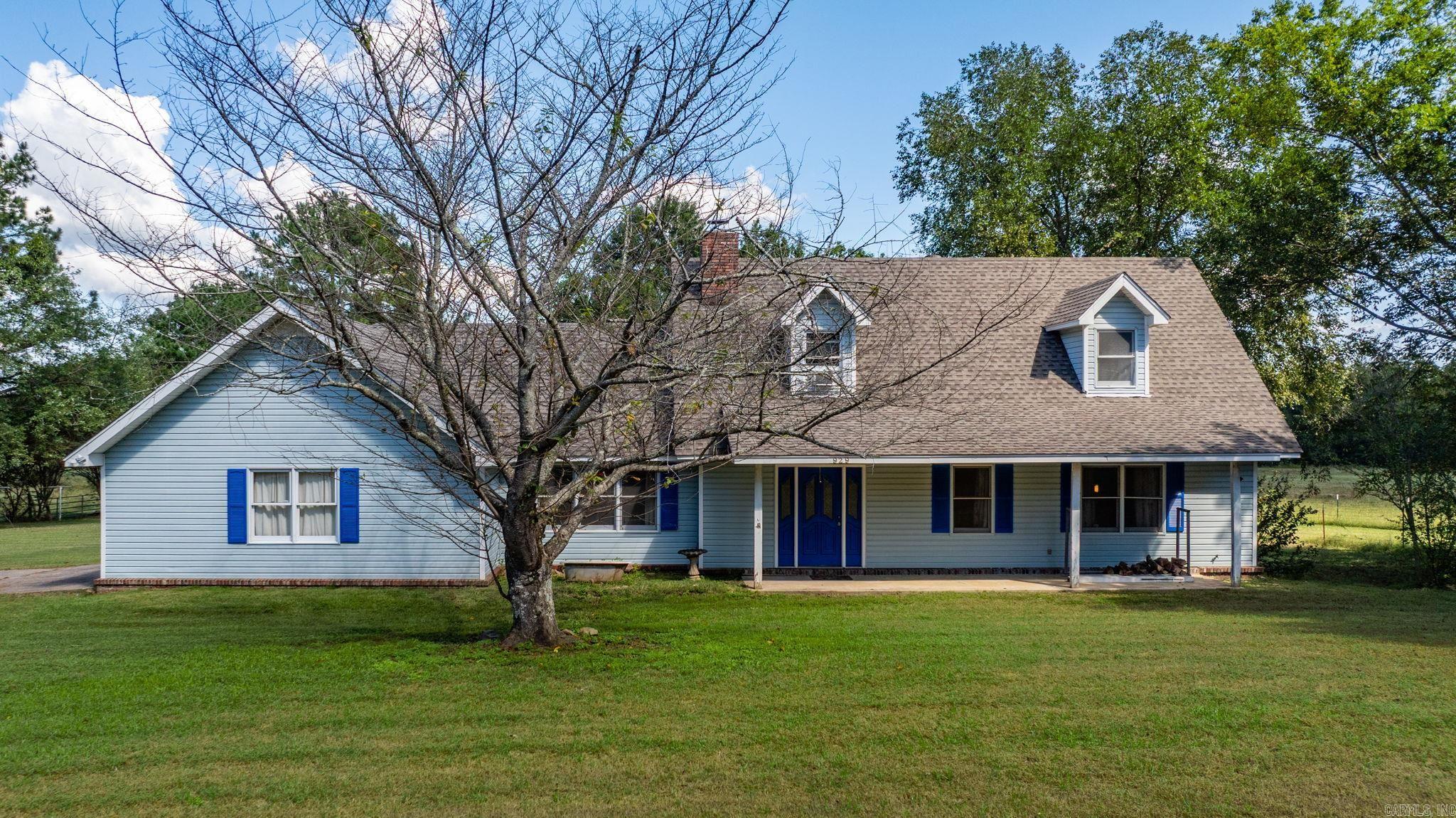 House sits on a Beautiful setting of 5 acres, shop, barn and built-in swimming pool. This 3 bedroom 2 1/2 bath home, has a family room with a cozy woodburning fireplace, great room. Primary bedroom down w/ extra closet space. Home has covered back porch and a 2 tier deck, around the in-ground pool, with covered patio 40X40 shop w/apartment & bath perfect for in-law quarters, 4 stall barn. Endless Possibilities! Perfect Country living!