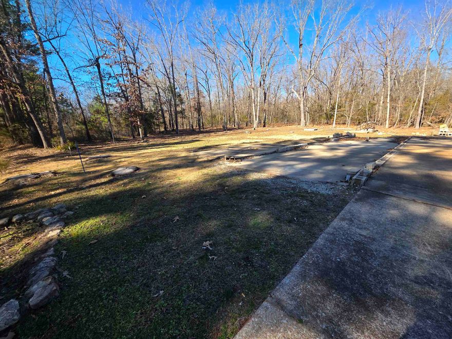 Great open lot in the Santa Fe addition. This lot has water and power on sight. The original septic system is on sight as well. Cement driveway and cement mobile home pad already on sight as well. This lot is available with all these amenities and improvements in place for a great low price. So, if you have been looking to be part of the Cherokee Village community, come get a look at this one before its gone. Don't forget that ownership of this property also gives you access to the Cherokee Village amenities such as the 7 Lakes, 2 golf courses and the beautiful Southfork River.