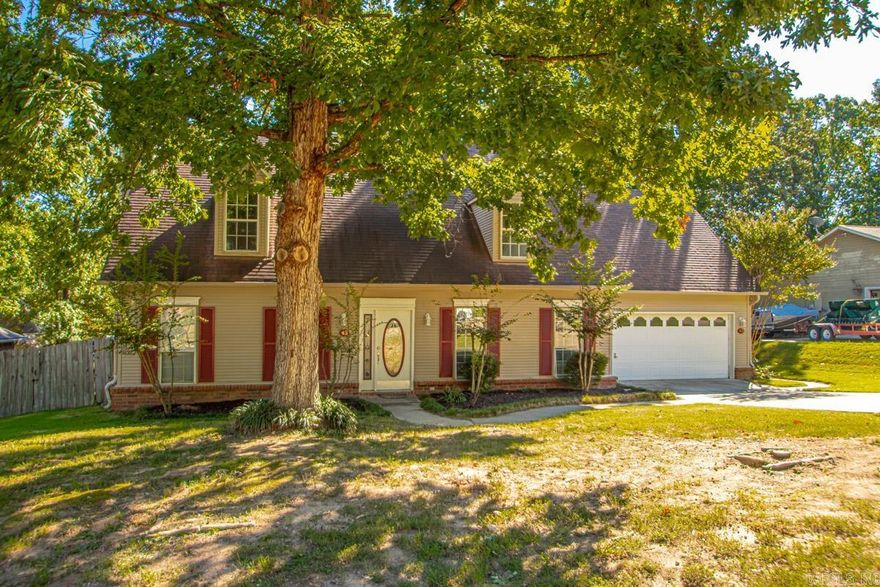 Fresh, inviting, and move-in ready. 43 Neal Cove sits in the sought after Bryant Oaks subdivision in Bryant, AR. This classic 4 bedroom, 2.5 bath home was built in 1990 and refreshed with new interior paint and durable vinyl plank flooring for a clean, modern look. A sunlit living room centers on a gas fireplace. The kitchen was thoughtfully expanded in 2012, adding abundant cabinetry, generous counter space, and a gas range. The open flow keeps cooks connected to conversation whether you are hosting friends or supervising homework. Upstairs, three comfortable bedrooms provide flexibility for guests, a nursery, or a home office. The primary suite includes a walk-in closet and a private bath. Out back, a fully fenced yard with mature trees offers shade and privacy. A large deck extends the living space for weeknight dinners, weekend projects, and quiet evenings. Well kept, updated where it counts, and ready for its next owner, this Bryant home delivers everyday comfort in a location buyers ask for. If you are searching for a home for sale in Bryant AR with four bedrooms, an expanded kitchen, a gas fireplace, and a fenced backyard, put 43 Neal Cove on your list.