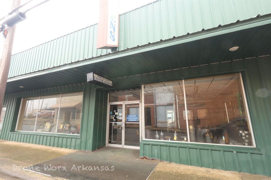 The third parcel in this building is one of the bigger parcels. There is plenty of traffic in the area with the county courthouse, MVD, Assessor's office, Clerk's office, Post Office, and more in walking distance.  This parcel is situated on the street level with a basement.  Both levels are heated and cooled. This would make a great retail store or restaurant having large windows on the Main Street and so close to many business and government offices.  With the heavily traveled Hwy 65 passing through Marshall, people come from all over to see the fall colored leaves, float the famous Buffalo National River, or head to Branson, MO for dinners and shows.  Just about 45 minutes north or south you will find hospitals, a community college, shopping, and more.