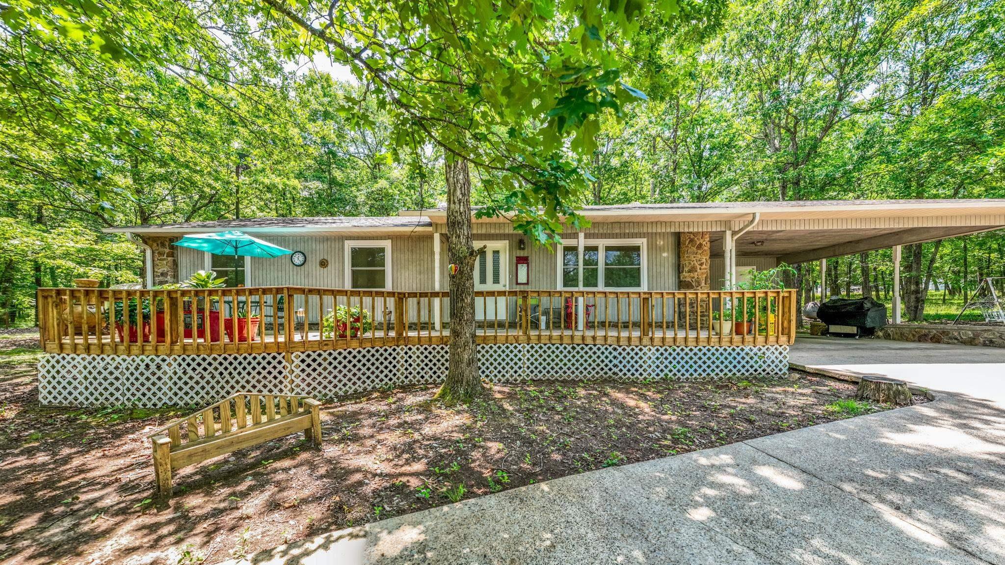 Very rare find. A beautiful, secluded setting with a well-maintained home all on 36 acres with a huge, stocked pond, several outbuildings and an insulated 40 x 30 shop with 38 amp plug and covered attached carport. Many upgrades and extras including central vac, generator and new stove, make this a truly dream home. Spend evenings on large, covered porch with gorgeous views. Property also includes a very nice mobile home for added income or space. Must see to appreciate all this lovely home has to offer