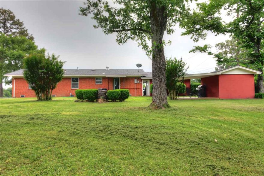 Beautifully updated, well built 3 BR/1BA home on Hwy 64 E.  Just minutes from I-40.  Updates include granite counters, painted cabinets, new gas range, fresh paint throughout, new fixtures, fans, lights and refinished expresso colored hardwood floors.  Home sits on a .71 acre lot & includes a nice 27x30 shop w/electric & 2 other storage bldgs.  Home also has a large formal dining room that could be an office or den.