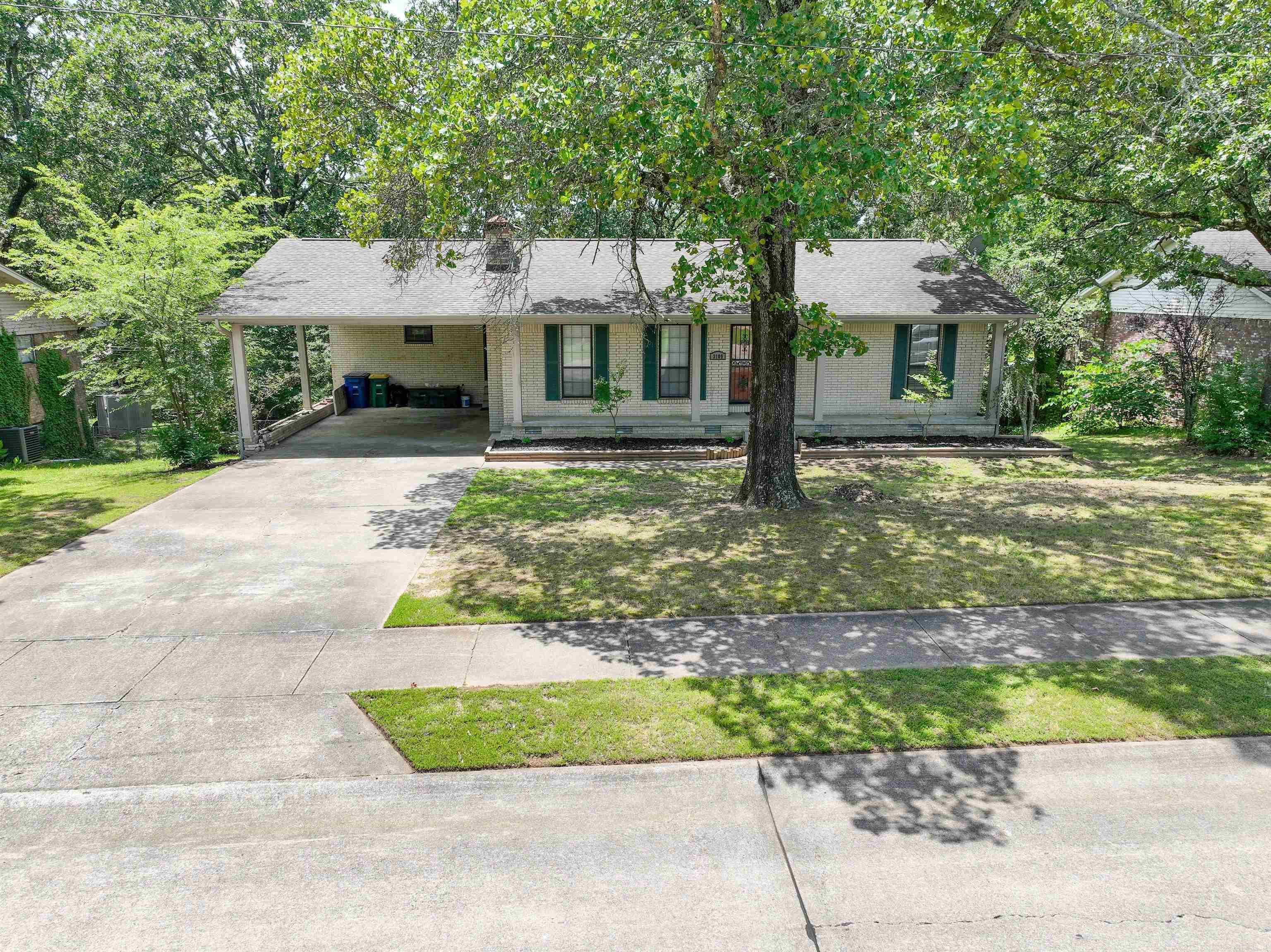 Charming Fully Remodeled Home in Lakewood Subdivision. This beautifully updated older home seamlessly blends character with modern upgrades. Featuring 3 bedrooms and 2.5 baths, it offers a spacious and versatile layout. Upstairs, you'll find a welcoming foyer with both wood and iron double doors, the living room has a cozy gas log fireplace, two bedrooms, and 1.5 baths. The open dining area connects to a stylish kitchen with gorgeous quartz countertops. Large closet that could be converted to a pantry. A large laundry room includes a built-in office space—perfect for working from home. Step out onto the expansive deck that overlooks a generous backyard, ideal for entertaining or relaxing. The front porch is pretty inviting as well. The lower level includes a third bedroom, full bath, and a large family room with a walk-out entrance. Don't miss the under stairs storage! Beneath the home, there’s a small workshop with water and power—ideal for hobbies or extra storage. Additional highlights include durable LVP flooring and carpet. Come see a host of unique features that make this home truly one of a kind.