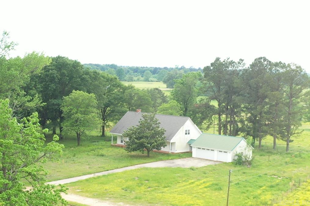 Beautiful setting at the end of a dead-end road surrounded by protected land. This 3 BR/3 BA house features a detached 3 car garage, all BRs downstairs and a huge bonus room with full bath upstairs, vaulted living room with fireplace, and an open kitchen overlooking the pond. The house comes with 6.37 surveyed acres, a pond, a pole barn with dedicated electricity, and a brand new well. The home is being sold as-is. Buyer will need to install flooring in the bedrooms and bonus room. The farm surrounding the house is now growing timber. This property has the utmost level of privacy at the end of the county road. The yard is large enough to have a hobby farm or build a second home or improved barn.