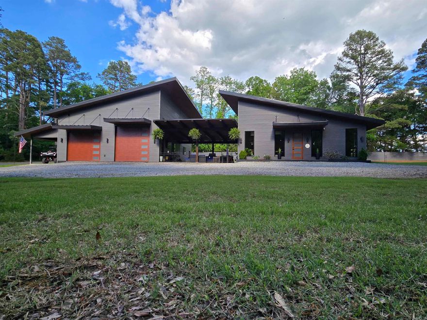LESS THAN 5 MIN FROM GREERS FERRY LAKE THIS HOME HAS IT ALL!! 4.02 ACRES INCLUDES 3 MORE LOTS TO BUILD IF YOU SO CHOOSE. CUSTOM BUILT 3850 SF DIVIDED BY ANOTHER 1600 SF OF BAREFOOT LIVING SPACE. OUTDOOR SPACE IS 1/2 COVERED WITH A TIMBER FRAMED PATIO, THE OTHER 1/2 IS A COURTYARD WITH WATERPROOF NEXAN DECKING, BLT IN BAR W/NAPOLEON GRILL, DOLOMITE COUNTERTOPS, SEATS 8, TV, AIR HANDLERS, 250k BTU BUILT-IN FIRE PIT. 1/2 OF THE HOME DESIGNED FOR FURTHER ADDITIONS, BEDROOMS, BUNKROOM/APARTMENT/MOTHER-IN-LAW/50 AMP SVC FOR RV'S, YACHT + 8X14 CONCRETE SAFEROOM/ FULLY EQUIPPED KITCHEN/FULL BATH AND WASHER/DRYER .  MAIN HOUSE BLT W/ GLOBAL SOURCED PRODUCTS-ITALIAN/SPANISH/TURKISH PORCELAINS FLOORS AND WALLS. HEATED FLOORS THROUGHOUT/10' CEILINGS. QUARTZ COUNTERTOPS & ITALIAN PORCELAIN PANELS IN THE KITCHEN & FIREPLACE/OPEN CONCEPT FROM THE KITCHEN, DINING & GREAT ROOM. STAINLESS APPLIANCES/WOOD VAULTED SINGLE SLOPE CEILING/WALK IN PANTRY/GUEST BATH, CEILING TO FLOOR WINDOWS/AUDIO SURROUND SOUND IN LR/PRIMARY BATH HAS IT ALL+ 12X32 STORAGE BLDG W/POWER EXTERIOR SIDING/MAINAINENCE FREE ARCHITECURAL CORRUGATED METAL/ROOF IS STANDING SEAM METAL  SEE REMARKS FOR SHOWING