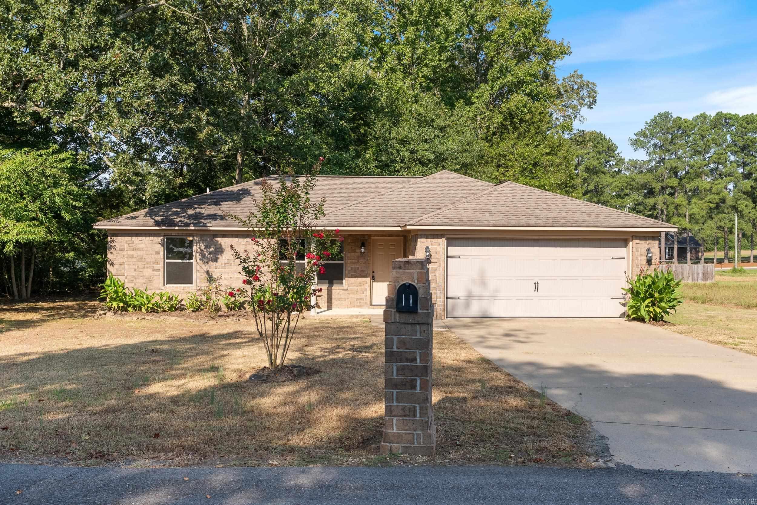 Beautifully remodeled home in the heart of Wooster, but with a country feel. Gorgeous luxury vinyl floors, new paint, new fixtures, and so much more! Stunning quartz countertops in the kitchen with all new stainless steel appliances. Split floor plan with primary suite apart from the other two bedrooms. The primary suite features a large walk-in closet and quartz vanity in the ensuite bathroom. Outside you'll find a front porch and back patio. The back yard and patio are the perfect gathering place to enjoy an outdoor meal and drink. The setting is beautiful. Great location with the highly rated Wooster Elementary less than a mile away. Easy access to Greenbrier (5 minutes away) and Conway (12 minutes away). This is a great price on a move-in ready home. Schedule your private showing today.