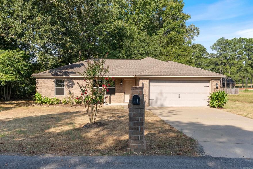Beautifully remodeled home in the heart of Wooster, but with a country feel. Gorgeous luxury vinyl floors, new paint, new fixtures, and so much more! Stunning quartz countertops in the kitchen with all new stainless steel appliances. Split floor plan with primary suite apart from the other two bedrooms. The primary suite features a large walk-in closet and quartz vanity in the ensuite bathroom. Outside you'll find a front porch and back patio.  The back yard and patio are the perfect gathering place to enjoy an outdoor meal and drink. The setting is beautiful. Great location with the highly rated Wooster Elementary less than a mile away. Easy access to Greenbrier (5 minutes away) and Conway (12 minutes away). This is a great price on a move-in ready home.  Schedule your private showing today.