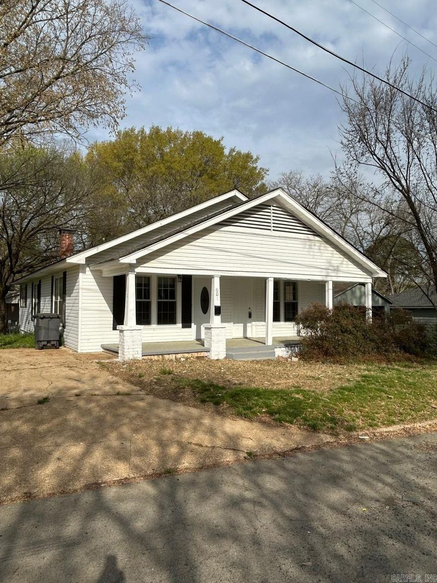Adorable renovated craftsmen style home with front porch, new 200 amp electrical service, new roof, lots of new updates and remodeled items, new countertop and stainless appliances. Plumbing water lines upgraded. Original Hardwood floors refinished, new lighting, new exterior doors, walk in shower, all located on a corner lot. Nice enclosed backporch has a Bonus area off laundry area could be office, craft room or walk in pantry.  Close to downtown and schools.