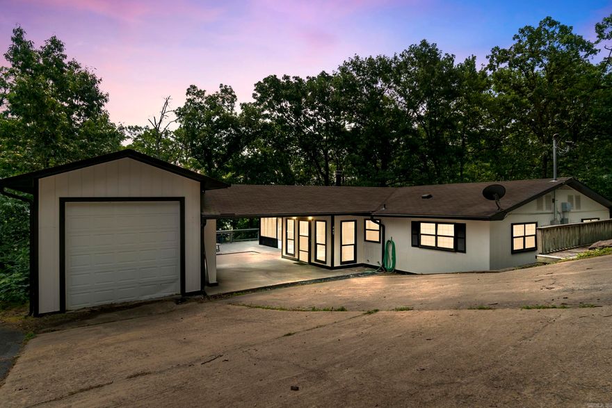 **Stunning Lakefront Retreat on Greers Ferry Lake!**  Welcome to your dream escape! This beautifully remodeled lakefront home boasts views and a gentle slope to the water!! Featuring gorgeous modern finishes throughout, this property combines luxury with comfort, making it ideal for both relaxation and entertaining.  Highlights of this fantastic home include: - A spacious layout with ample natural light. - A large garage and an expansive shop, perfect for storing all your lake toys and equipment. - A successful vacation rental history, offering great investment potential. - A brand new deck, perfect for soaking up the sun and enjoying the stunning lake views. - Fresh outdoor paint, ensuring the exterior looks as inviting as the interior! -New A/C Unit & Ductwork!! - additional window units are not needed but were left incase buyer preferred to have them!  Don't miss out on this incredible opportunity to own a piece of paradise on Greers Ferry Lake. Whether you're looking for a personal getaway or a lucrative rental investment, this home has it all! Schedule your private showing today!