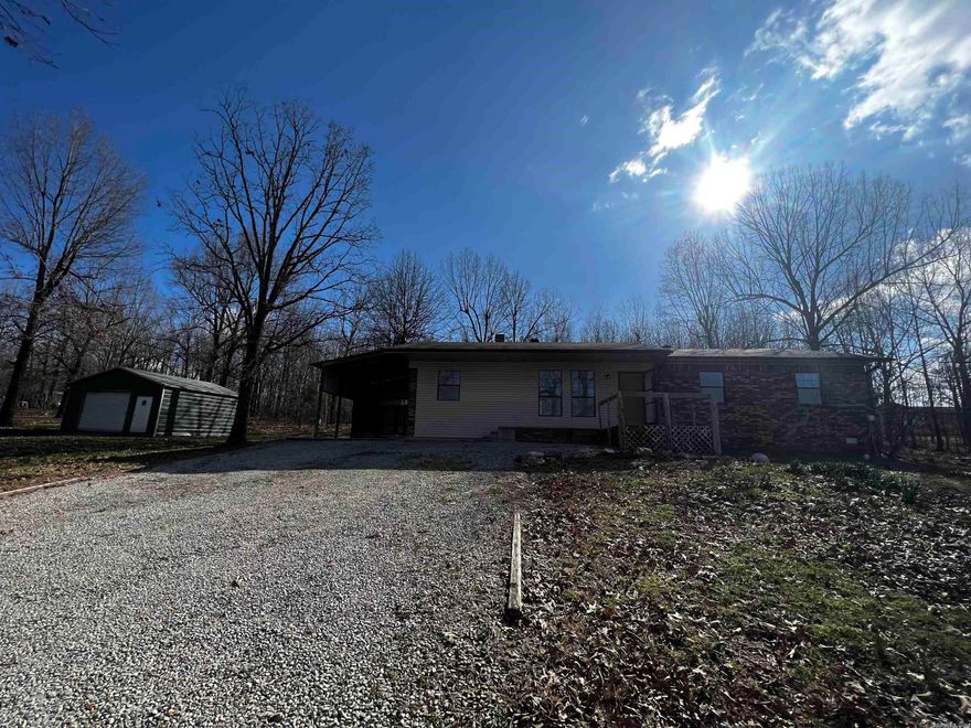 4 bed 1.5 bath on 2.0 acres+/- located on a paved road. 18x20 shop/garage. Centrally located, easy access in & out, great large yard for a garden area, for kids to play, or any outdoor activities. Central heat and air with back up wood heat. Largest bedroom located off the living living room away from other 3 bedrooms & 1.5 baths on the other end of the home.