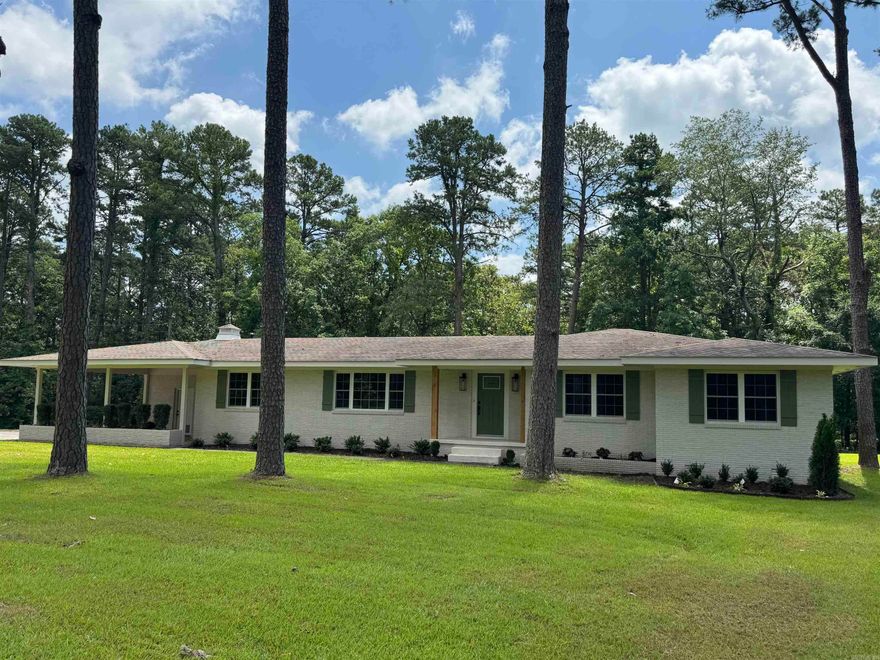 Price Reduced! Includes extra lot for future growth: Boat Storage, Shop, Mother-in-law or build an Airbnb!!  Charming Modern Farmhouse in the Greers Ferry Lake Area.  Discover the perfect blend of rustic charm & modern style in this beautifully updated home nestled on over 2.34 acres. With a freshly painted exterior, eye-catching cedar columns, and brand-new windows, this home offers curb appeal and comfort from the moment you arrive.  Step inside to an inviting interior, fully renovated with (LVT) flooring, fresh paint & striking light fixtures. The updated kitchen is a showstopper—featuring new custom cabinets, granite, under cabinet lighting and a layout perfect for entertaining.  The home boasts two spacious living areas: one with a stunning stone fireplace that adds warmth and character. All the bedrooms are very spacious with walk-in closets. You must check out the updated designer bathrooms that offer stylish finishes and functionality.   Enjoy the outdoors on the brand-new deck—ideal for morning coffee or evening gatherings—while the expansive lot provides room to roam, garden, or simply enjoy the peace and quiet of the countryside. Bonus: 20x24 Shop/Garage for lake toys.