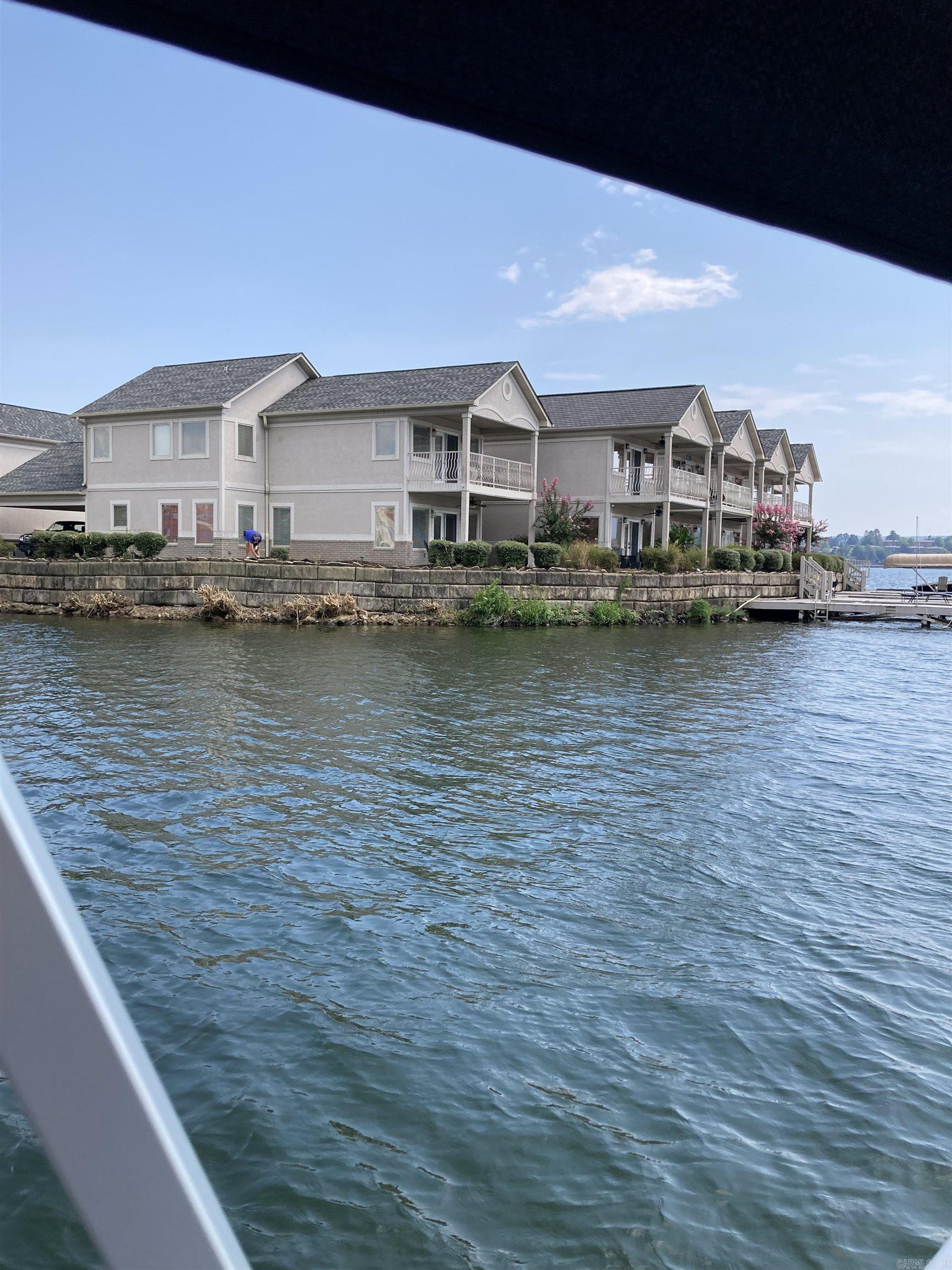 Lakefront 4 bedroom, 3 bathroom condo on Lake Hamilton. Gated community. Fully furnished, including washer, dryer and propane grill. All utilities included. Boat Dock. 2 covered patios. 2 car carport. Community pool. No pets. Minimum 3 month lease and maximum 6 month lease.