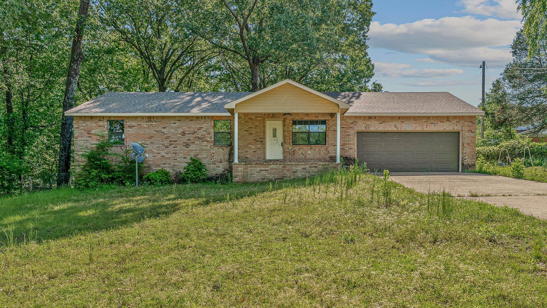 Rare find in Valley View School District. 17.25 acres fenced for livestock, shop building, 12 x 12 she shed w/electricity and 3 bedrooms, 3 full baths brick home to be sold AS IS Home is all electric except for propane water heater and wall furnace that will remain. Master suite with spacious walk in closet and bath. Sunroom has brick area for wood burning stove (that is currently in shop and will remain) and beautiful brick floors. Two security lights by home and shop. Per owner the roof was replaced in 2015 and CH&A 2017.