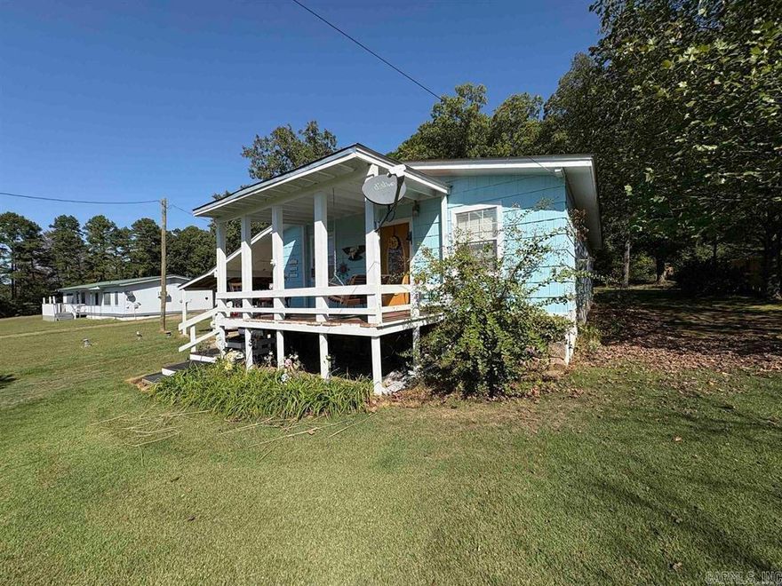 Welcome to this beautifully maintained home in Shirley, Arkansas, just 5 minutes from the picturesque Fairfield Bay Lake! This charming property features a new roof, ensuring peace of mind for years to come. The meticulous care put into the home is evident in every detail, making it move-in ready for its new owners. Accessibility is a highlight, with a convenient ramp at the back and wide steps at the front, catering to all needs. The layout offers a welcoming atmosphere, perfect for both relaxation and entertaining. Natural light floods the spacious living areas, creating a warm and inviting environment. The surrounding area is perfect for outdoor enthusiasts, with the lake offering opportunities for fishing, boating, and hiking. Enjoy the tranquility of country living while still being close to local amenities. This home presents a unique opportunity to own a slice of Arkansas paradise. Whether you’re seeking a permanent residence or a vacation getaway, this property checks all the boxes. Don’t miss your chance to experience comfortable living in a fantastic location—schedule your showing today!