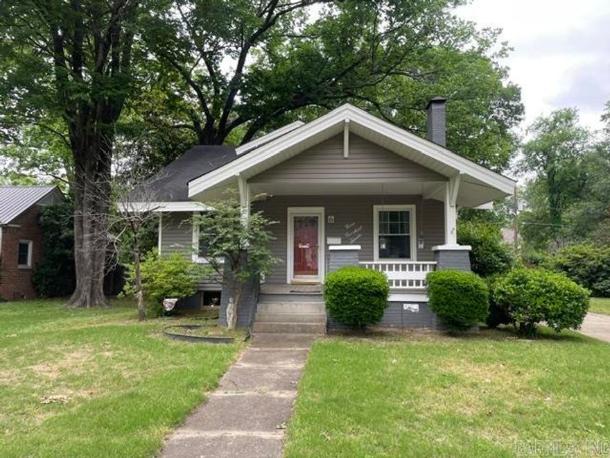 Great craftsman style house with a quaint front porch.  It has driveway from front to back, with a carport for 2 cars detached in back next to storage building .  Also has a sitting area off the back entrance.  Inside top floor, contains a full bath, and 2 bedrooms.  Middle floor has living space, dining area, full bath, bedrooom with sitting area, kitchen all ready for you and your family.  The basement is unfinished with laundry area, water heater, and sump pump.