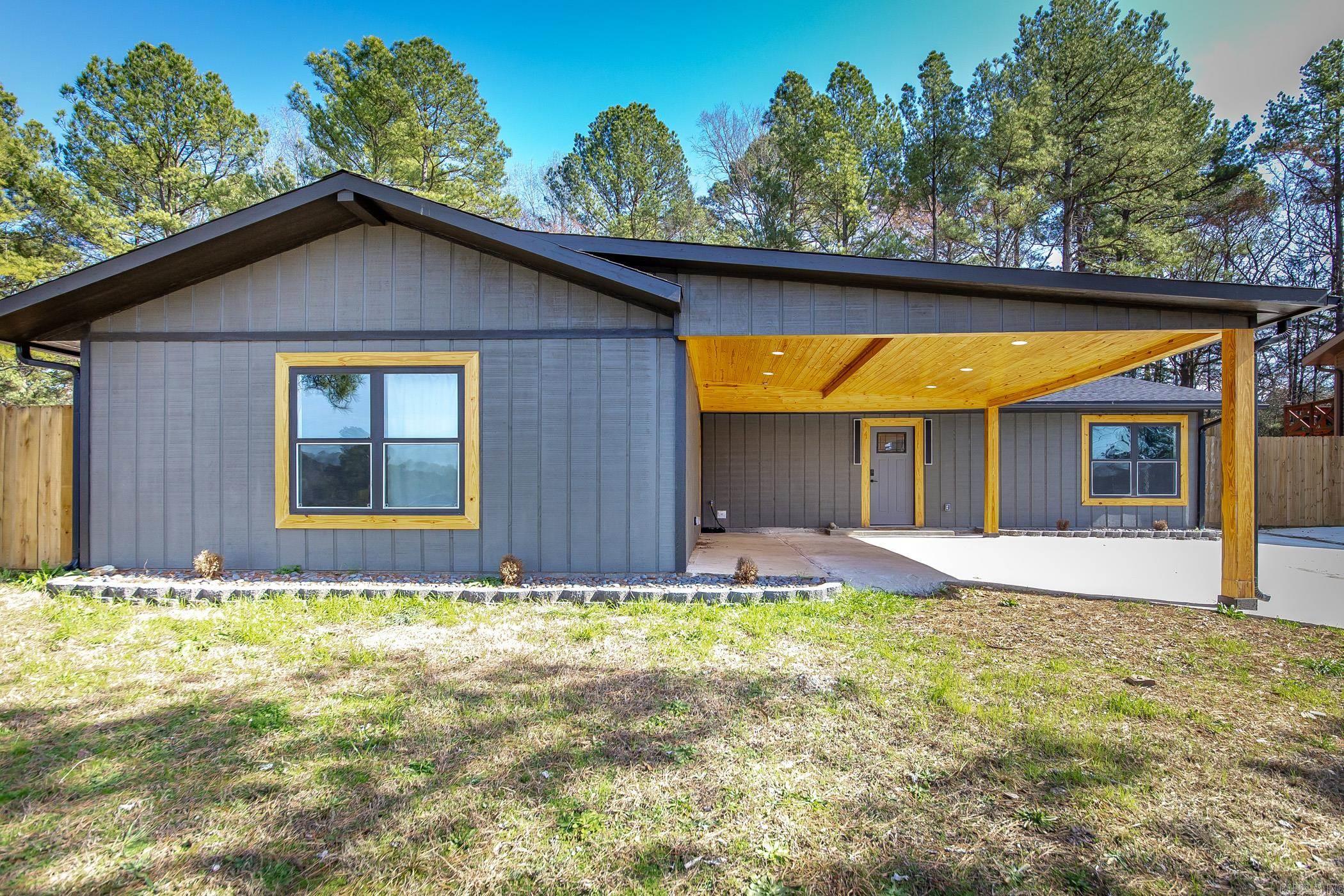 "NEWLY CONSTRUCTED - BUILDER OWENED" 3BR/2BA Newly Built Custom Home This is the perfect house for a small family looking to be within Hot Springs, but still feel outside of the city. Conveniently located outside the city limits but close to the lake, shopping, airport, and there is a neighborhood playground within walking distance. Covered Parking with beautiful tongue and grove wood big enough for 2 cars, with additional parking on the side pad. Open concept in the Dinning/Living room with vaulted ceilings and a breakfast bar connecting the kitchen. Granite countertops and all new appliances round out the perfect kitchen for all those friend and family meals to be cooked. Double vanity in the master bath as well as a lien closet. Master bath also comes with a rain showerhead and tile bench seat. Third bedroom is big enough for several beds or can be converted into a spacious home gym. Finally the covered patio has the perfect firepit to hang out and enjoy the wonderful outdoors. House is Occupied. All showings are by Appointment Only Please Call or Text Steve Hibbard - 501-445-4420 to set up the appointments.