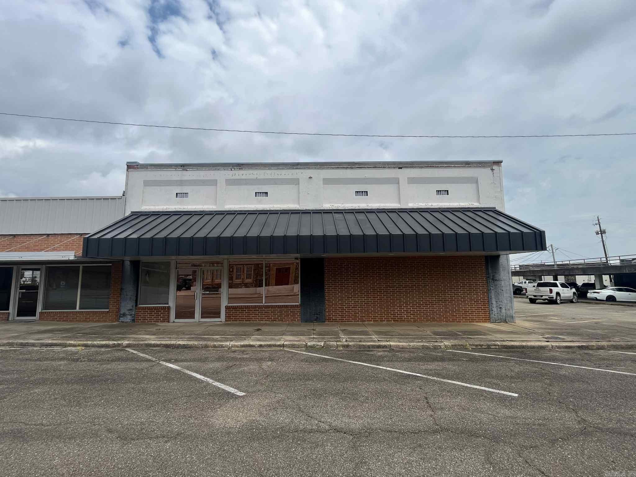 Looking for a commercial office building in the heart of downtown Mena? This expansive, 5000 sq ft. space on DeQueen St. is ready for your business ideas! With 10 separate offices, you could rent out each one separately, or use the entire building as one! Features include high ceilings throughout, a large well maintained shared kitchen, two recently renovated bathrooms, attractive paint throughout, a nice storefront space, and ample parking! Located right in the center of town, and only minutes to the new bike trail system, this is an excellent investment opportunity!