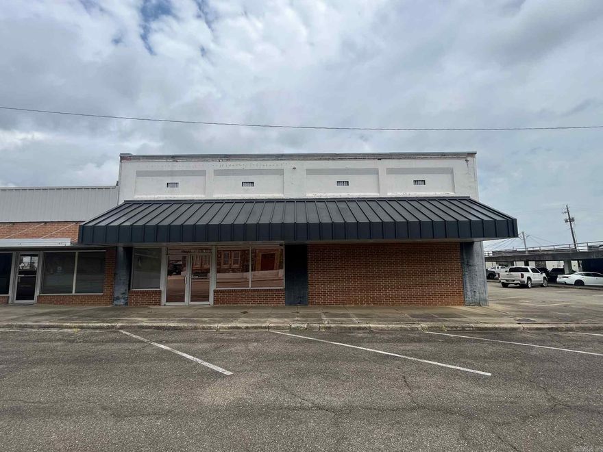 Looking for a commercial office building in the heart of downtown Mena? This expansive, 5000 sq ft. space on DeQueen St. is ready for your business ideas! With 10 separate offices, you could rent out each one separately, or use the entire building as one! Features include high ceilings throughout, a large well maintained shared kitchen,  two recently renovated bathrooms, attractive paint throughout, a nice storefront space, and ample parking! Located right in the center of town, and only minutes to the new bike trail system, this is an excellent investment opportunity!