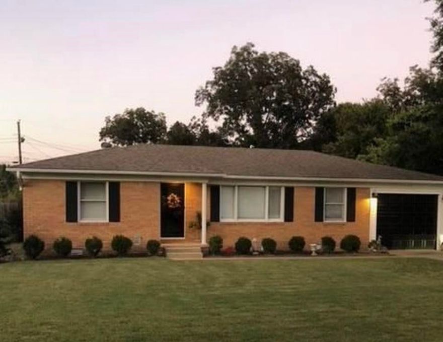 Very nice home in quiet area. This Adorable home is spacious with Three Bedrooms, 2 Bathrooms, Formal Dining room, Sunroom on the back with a large storage closet and one car garage with a nice room attached that can be used for an office, weight room or just about anything you would like. The back yard is fully fenced with a storm shelter and a great covered area for cooking out or just a place to sit and relax.