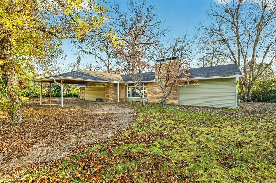 Welcome to 1122 N Waldron Rd — A Charming Mid-Century Gem with Room to Grow.  Step inside this lovely 3-bedroom, 2-bath home with 1,834 sq ft of cozy living space tucked on a 0.33-acre lot in Fort Smith’s Eastwood neighborhood. From the moment you walk through the door, you’ll appreciate its classic charm: original pine hardwood floors, a warm wood-burning fireplace in the living room for cozy evenings, and another unique mid-century-style fireplace that offers a creative twist many homes don’t have.    The heart of the home is a spacious eat-in kitchen with generous storage  — perfect for family breakfasts or hosting friends. The large laundry room adds convenience. Outside, the fenced backyard features a shed for extra storage, and a yard that invites a grill, gardening, or a safe play area for kids and pets.  Welcome home!  Agents please see remarks.  Owner Occupied.