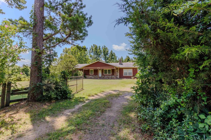 Spacious 4-bedroom, 2-bath home in Perryville, AR situated on 1.25 unrestricted acres - just 35 minutes from Conway & Little Rock! This country property offers plenty of room to spread out, featuring a large laundry room, two storage buildings, and recent updates throughout. Enjoy low utility bills thanks to updated insulation, and cook with ease in the kitchen featuring a new propane-powered gas range. New flooring has been installed, and the living room boasts a beautiful stone wood-burning fireplace—perfect for cozy nights. If you're looking for peaceful country living with space and functionality, this home is move-in ready and waiting for you! Work from home? No problem. Connect2First brings fiber internet to this home!