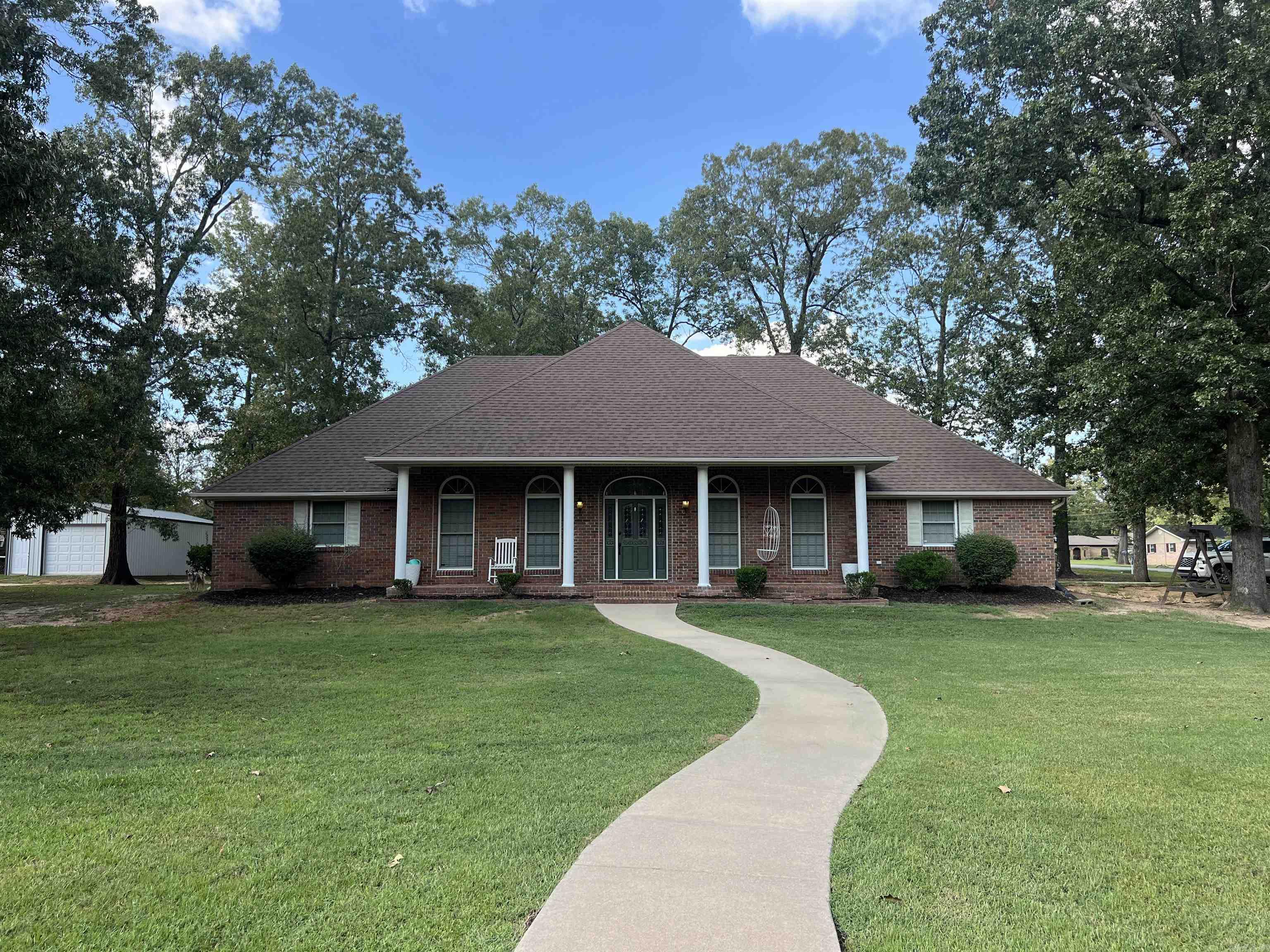 Welcome home to this spacious and inviting, this four-bedroom, two-bath brick home offers comfort and functionality throughout. The large fenced-in backyard provides privacy and plenty of room for outdoor fun, complete with a back patio perfect for grilling and entertaining, plus a welcoming front porch to enjoy quiet evenings. Inside, the generous master suite features two oversized walk-in closets, dual vanities, a tiled shower, and a beautiful garden tub surrounded by tile. The large kitchen is a chef’s dream with abundant cabinets, stainless cookstove, and butcher block countertops. A separate dining room, currently used as a family game room, adds versatility to the layout. The spare bedrooms include ample closet space, while the fourth bedroom is being used as an office. The guest bath is upgraded with a tiled shower. A two-car carport provides plenty of storage space, rounding out this well-appointed home that is situated on a corner lot on .81 acre lot in a coveted neighborhood. This home qualifies for rural development financing which could mean ZERO Down Payment.